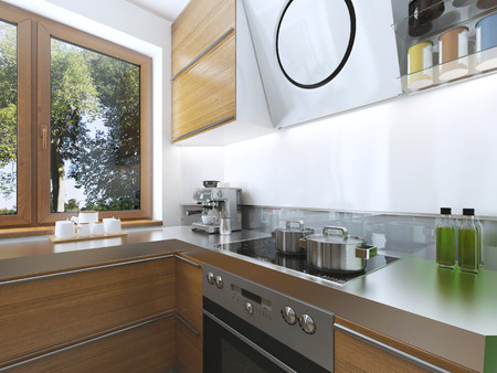 Modern kitchen in the dining room Contemporary style. kitchen facades of light wood with a hood over the stove and built-in appliances. Metal working surface. 3D render.の写真素材