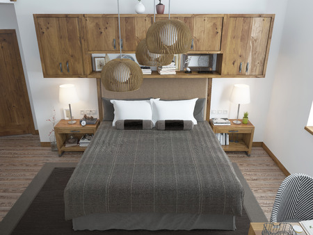 Large bright bedroom in the loft. Above the bed hang shelves closed and bedside tables with decorations. Furniture in rustic style. 3D render.の写真素材