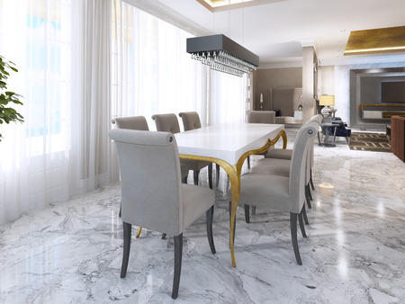 Large dining table for eight in the style of art Deco. White Desk with gold legs and a soft fabric chairs in beige. 3D render.の写真素材