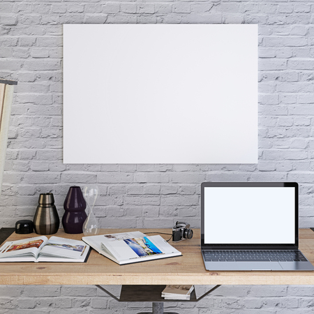 Mockup blank poster on a white brick wall with a laptop on the desktop. 3D render.の写真素材
