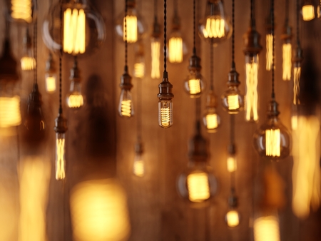 The light from the Edison lamp. Hang on the background of a wooden wall, depth-of-field camera...