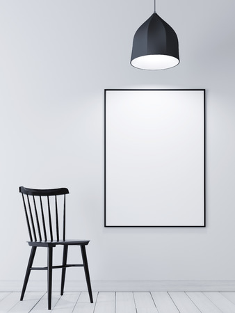 Mock up poster frame on the white wall with black chair and lamp. 3D renderingの写真素材