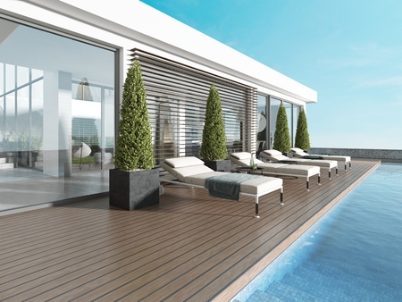 Terrace by the pool with sun loungers near the modern house. 3D renderingの写真素材