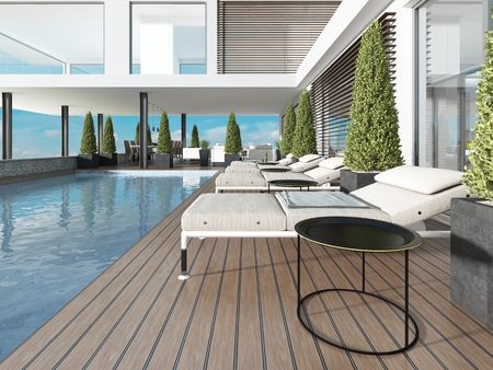 Terrace by the pool with sun loungers near the modern house. 3D renderingの写真素材
