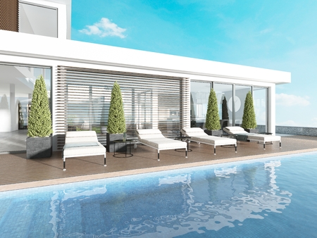Terrace by the pool with sun loungers near the modern house. 3D renderingの写真素材
