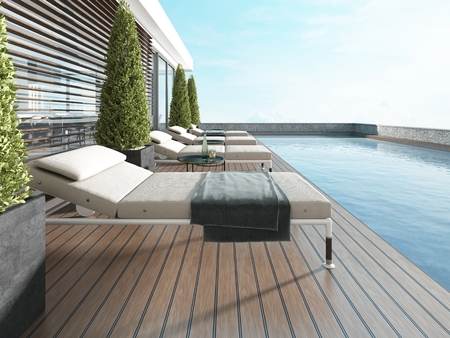 Terrace by the pool with sun loungers near the modern house. 3D renderingの写真素材