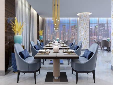Luxurious modern restaurant in the evening lighting with blue and beige chairs and laid out tables. White columns in a mosaic tile. Gold plated pendant lights. 3d rendering.の写真素材