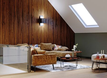 A modern attic with a living space, a sitting area with a large corner sofa and a fireplace, a working space with a desk, a lot of flowerpots with greenery. 3D rendering.の写真素材