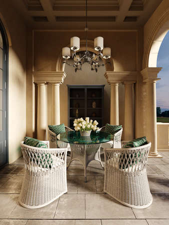 A wicker dining table with glass top and wicker chairs on a pillared terrace in the evening sun. 3D rendering.の写真素材