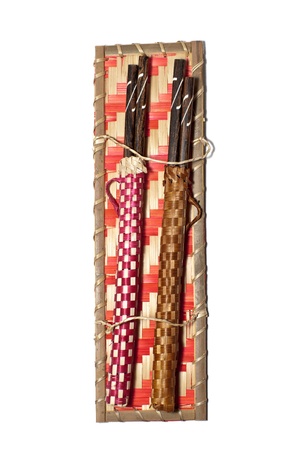 two pairs traditional chopsticks isolated on whiteの写真素材