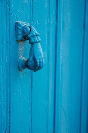 An old blue painted door knocker. Captured in Cyprus.の写真素材