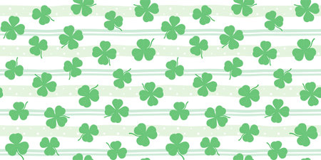 Green shamrocks and clover leaves on a soft striped background. St. Patrick's Day endless texture. Vector seamless pattern for festive wrapping paper, packaging, giftwrap and printのイラスト素材