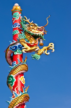 Chinese style dragon statue with blue sky の写真素材