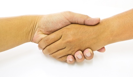 Shaking hands of two male people, isolated on white の写真素材