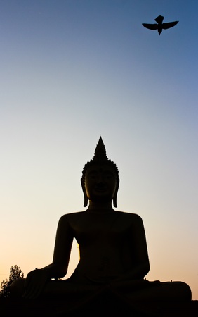 Silhouette of buddha statue の写真素材