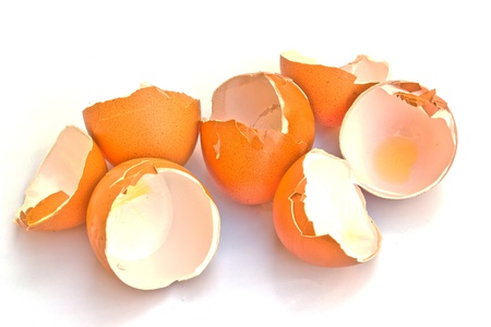 Broken egg shell isolated on white background の写真素材