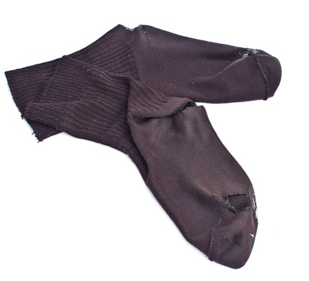 Two worn black socks on the whiteの写真素材