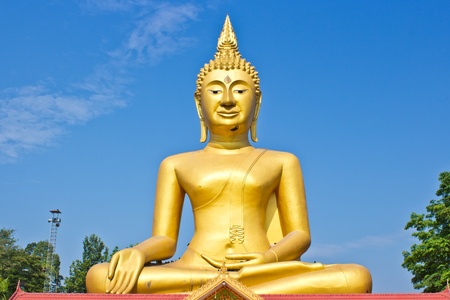 Golden Statue of Buddha in Thailand and blue skyの写真素材
