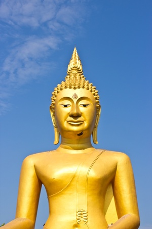 Golden Statue of Buddha in Thailand and blue skyの写真素材
