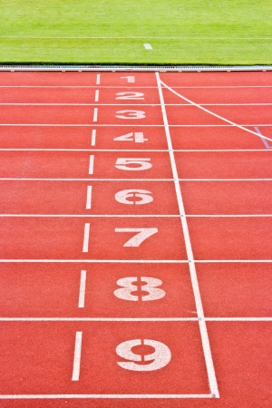 Red running tracks.Numbers one through nine.の写真素材
