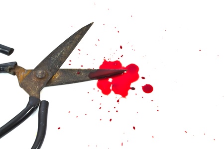 Old scissors and a drop of blood.の写真素材