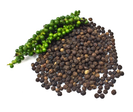 Fresh green peper on heap of Black Pepper,Thai Indian Spiceの写真素材