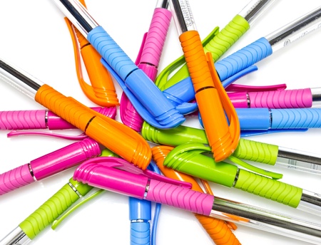 Colorful pen on white background.(blue, green, orange, pink)の写真素材