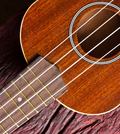 ukulele on wood backgroundの写真素材