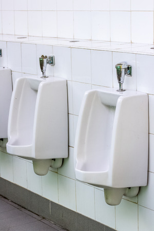 Dirty chamber pot in toiletの写真素材