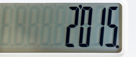 Close up photo of white color calculator put on black leather surface background on calculator...