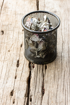A lot of wrinkled paper laying in basket.の写真素材