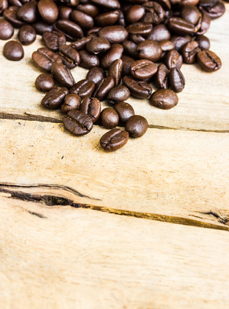 Coffee beans on wood backgroundの写真素材