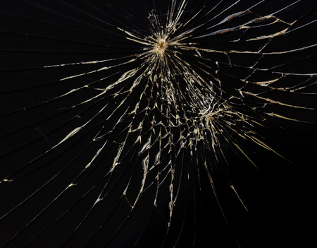 broken horizontal glass black backgroundの写真素材