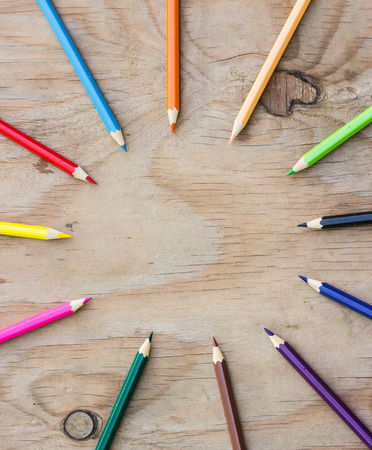 Color Pencils on wooden background.の写真素材