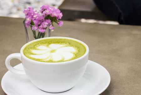 milk green tea on wooden floorの写真素材