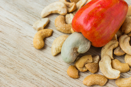 Cashew Nut Apple and Fresh Cashew Nut on woodの写真素材