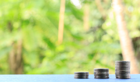 Medal tiles for a bar graph. The volume increase on black wooden floor.の写真素材