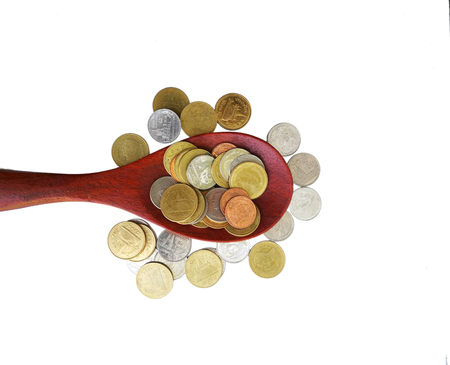 Thai coins in the wooden spoon on white backgroundの写真素材