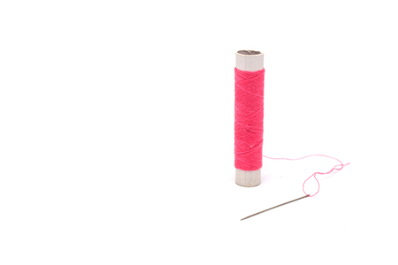 thread with needle on white background.の写真素材