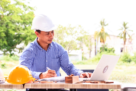 Engineer working using laptop computerの写真素材