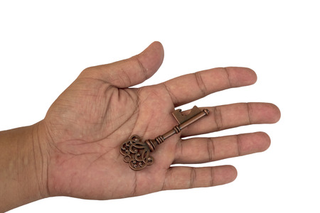 hand holding the key on white background.の写真素材