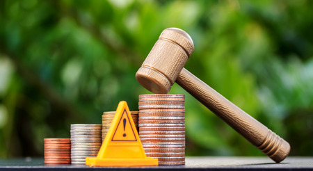 coin hammer and warning sign on nature background. Investment Ideas.の写真素材