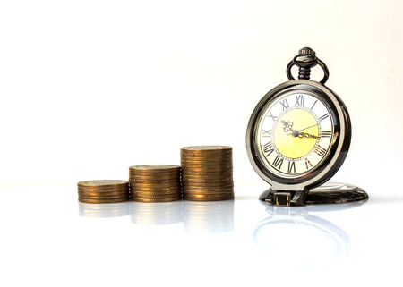 Alarm clock and money on white background.の写真素材