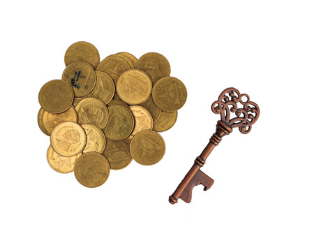 Money savings and growing - gold coins and success keyの写真素材