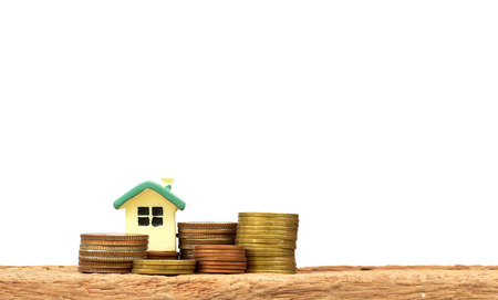 Mini house on stack of coins. Concept of Investment property.の写真素材