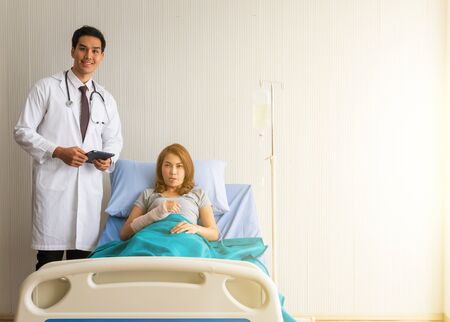 Female patients come to see a doctor to check for elbow pain. medical and healthcare conceptの写真素材