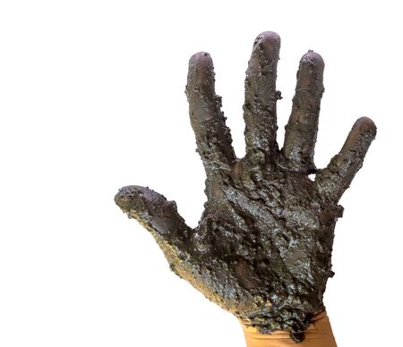 Hands with mud on white background.