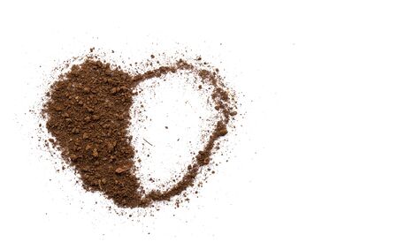 The soil on a white background with a heart shape conveys love and care.の写真素材