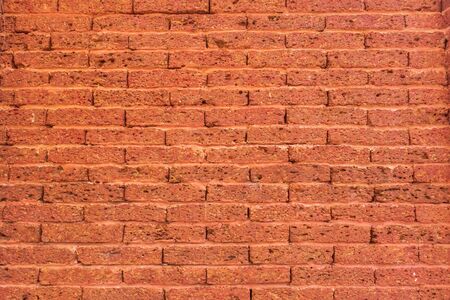 Old red brick wall as backgroundの写真素材