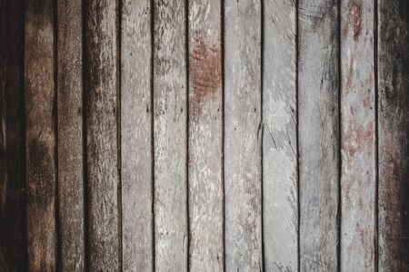 vintage wood background texture with knots and nail holesの写真素材